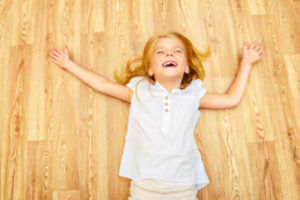 young-girl-laying-on-floor-with-underfloor-heating